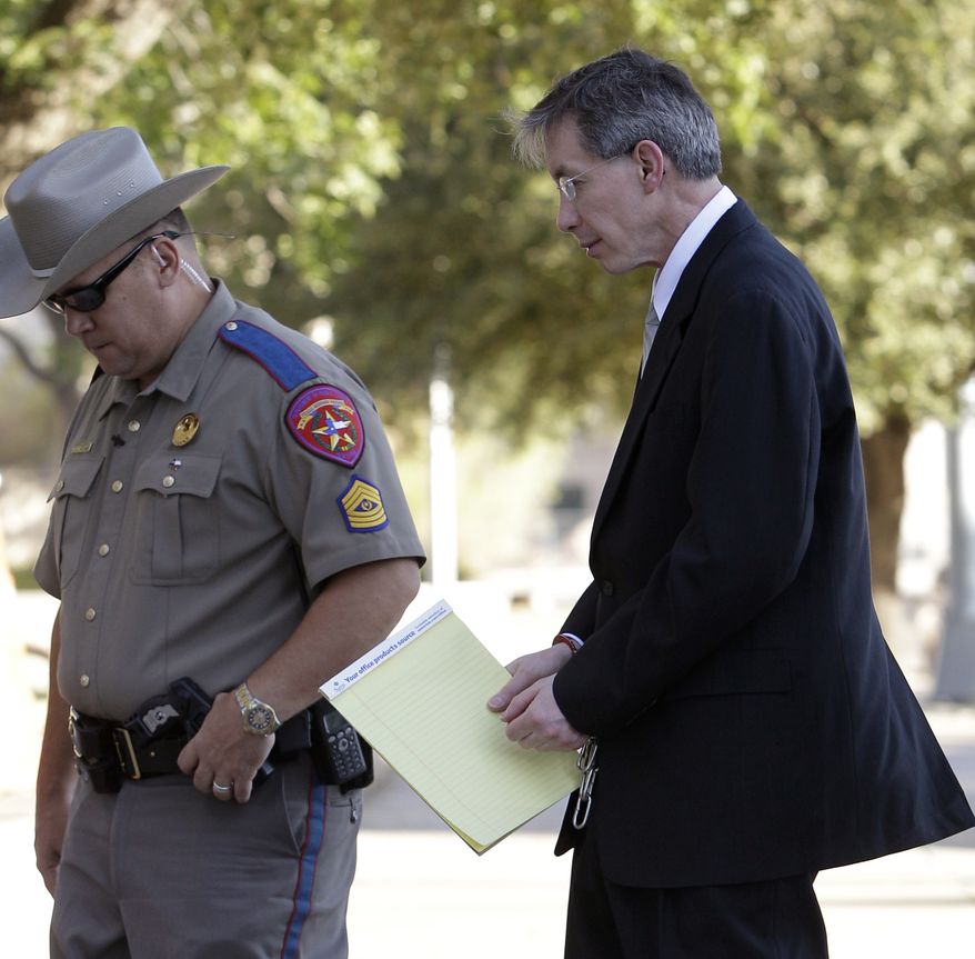 ** FILE ** Polygamist religious leader Warren Jeffs arrives in hand shackles to the Tom Green County Courthouse for the sentencing phase of his trial Friday, Aug. 5, 2011, in San Angelo, Texas. (AP Photo/Tony Gutierrez)
