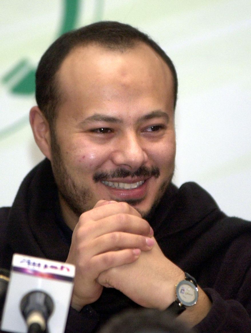**FILE** Mohammed Moammar Gadhafi, Libyan Col. Moammar Gadhafi's eldest son, smiles in Tripoli during a news conference on Dec. 29, 2003. (Associated Press)