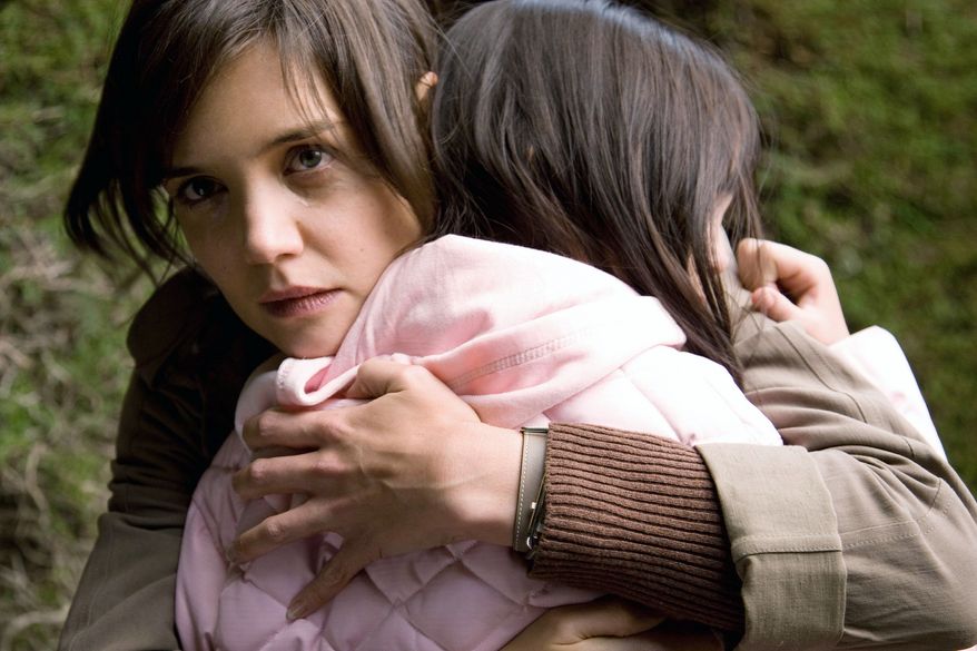 Kim, portrayed by Katie Holmes (left), and Sally, played by Bailee Madison, set aside their family squabbles to fight hairy fairy monsters in "Don't Be Afraid of the Dark." (Film District via Associated Press)