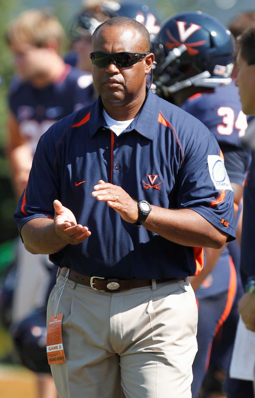 Virginia coach Mike London can continue take away possible Maryland recruits with a win on the road Saturday. (Associated Press)