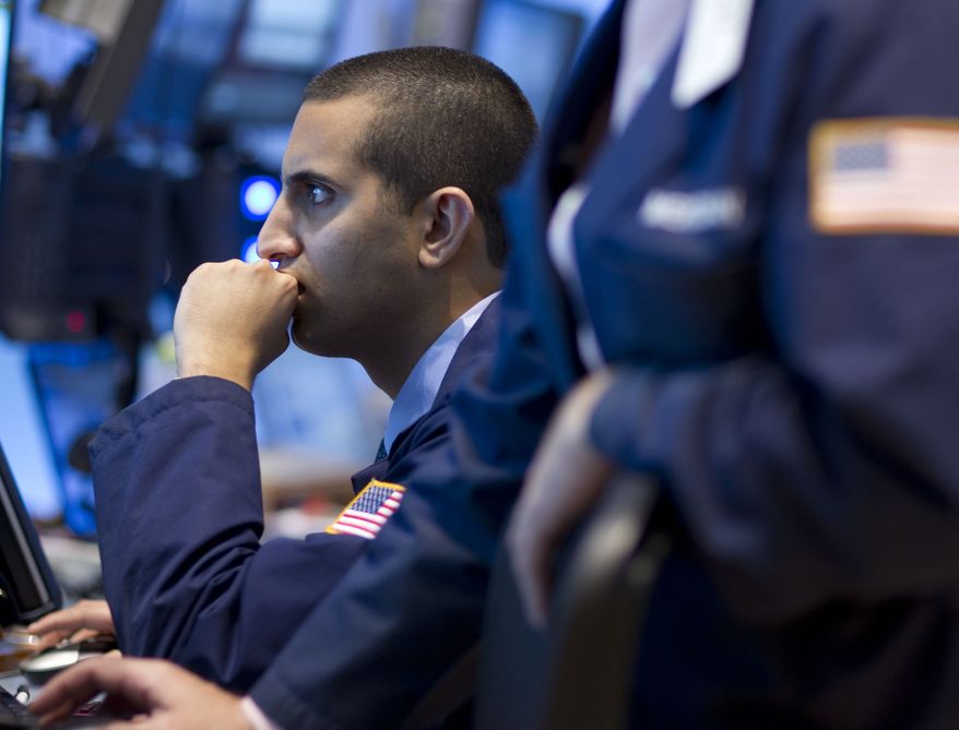 A trader works Sept. 2, 2011, on the floor of the New York Stock Exchange on in New York. (Associated Press)