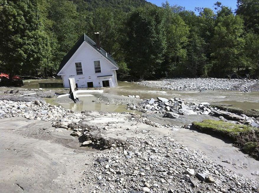 A home in Pittsfield, Vt., is partially submerged after floodwaters from Hurricane Irene ravaged the state in 2011. (Associated Press)