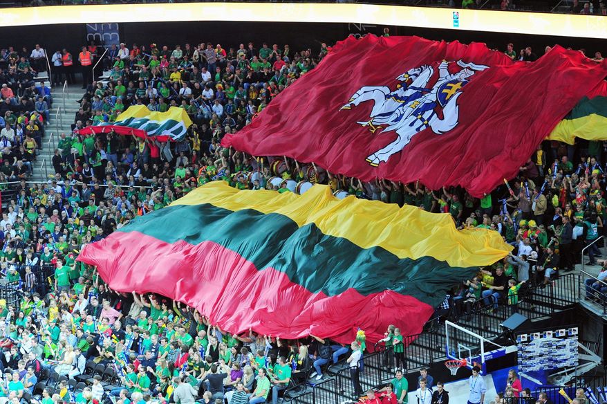Lithuanian fans unfurl flags as they revel in the game. (Christopher Johnson/Special to The Washington Times)