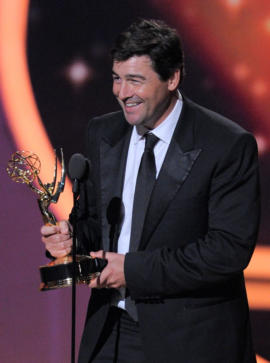 Kyle Chandler, who played a high school football coach in "Friday Night Lights," holds his Emmy for lead actor in a drama series. "I knew for a fact I would not be standing here. I did not write anything," he said. (Associated Press)