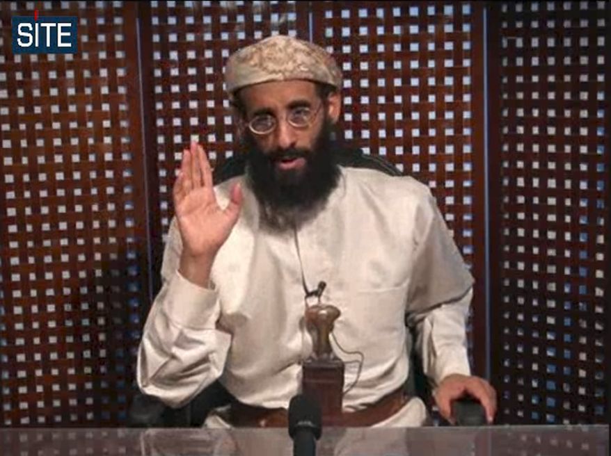 **FILE** In this image taken from video on Nov. 8, 2010, and released by SITE Intelligence Group, Anwar al-Awlaki speaks in a video message posted on radical websites. (Associated Press/SITE Intelligence Group)
