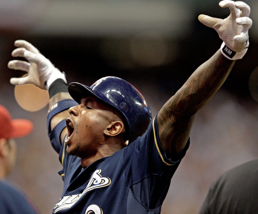 Milwaukee's Nyjer Morgan made a clutch catch against Arizona in Game 1 of their NL playoff series and delivered a two-run single in Game 2. The series shifts to Arizona for Game 3 on Tuesday. (Associated Press)