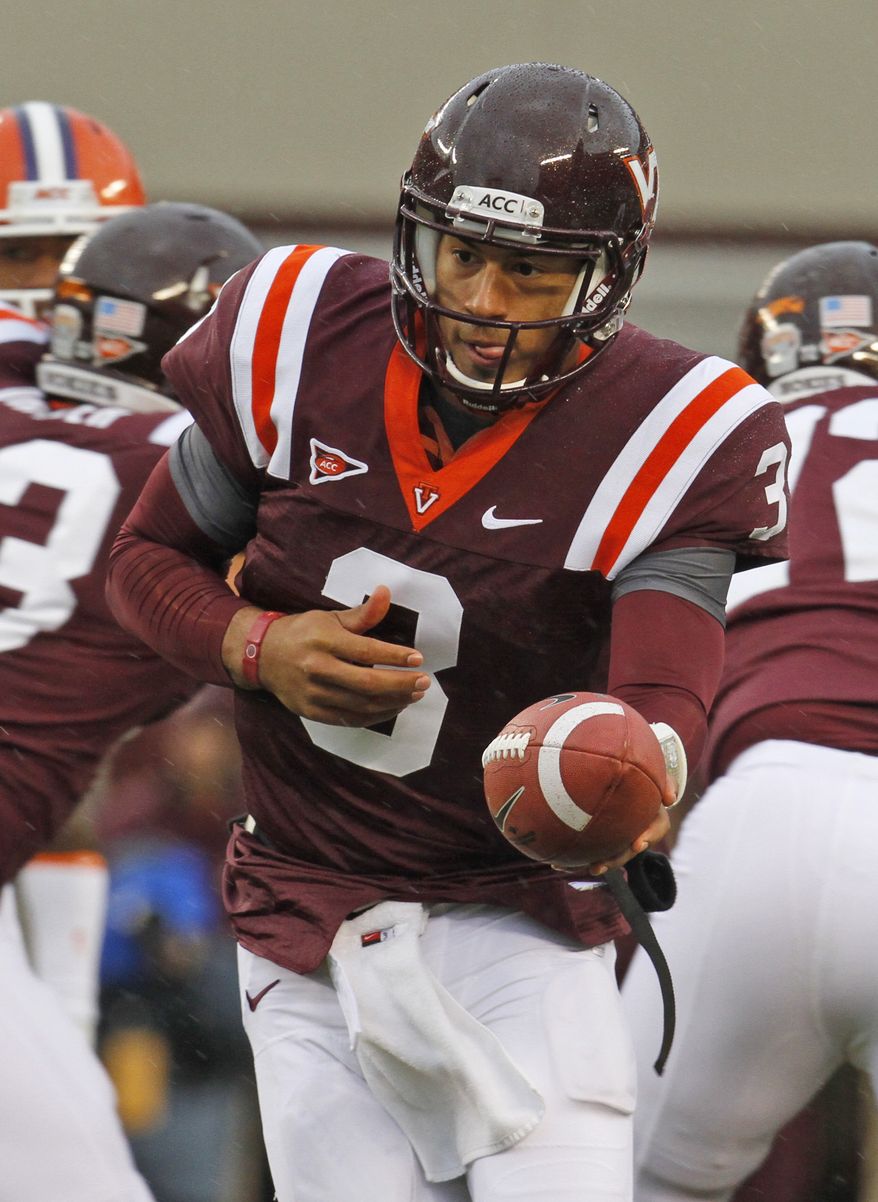Virginia Tech quarterback Logan Thomas (3) hands off the ball during the first half against Clemson at Lane Stadium in Blacksburg, Va., Saturday, Oct. 1, 2011. (AP Photo/Steve Helber)