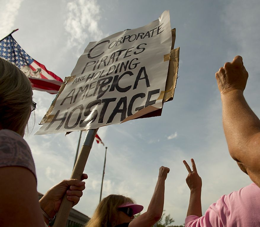 A group of protestors arrive at Freedom Plaza during a protest affiliated with the "Occupy D.C." movement in Washington, D.C., Monday, October 10, 2011. (Rod Lamkey Jr/The Washington Times)