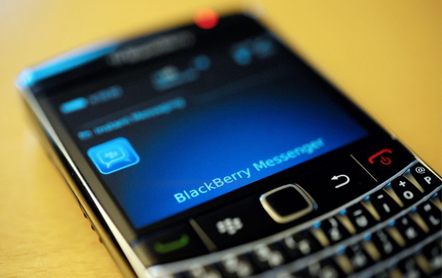 **FILE** This photo taken Sept. 8, 2011, shows a BlackBerry smartphone using the "Messenger" service in Berlin. (Associated Press)