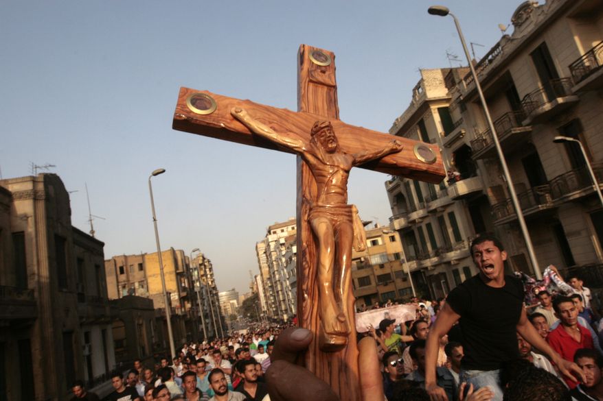 Egyptian Christians protest outside St. Mark's Cathedral in Cairo against the country's military ruling council on Monday, Oct. 10, 2011. (AP Photo/Amr Nabil)