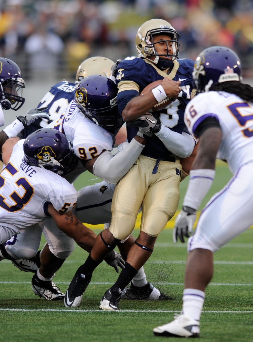 Navy quarterback Trey Miller passed for two touchdowns against East Carolina on Saturday, but the Midshipmen still came up short. (Associated Press)