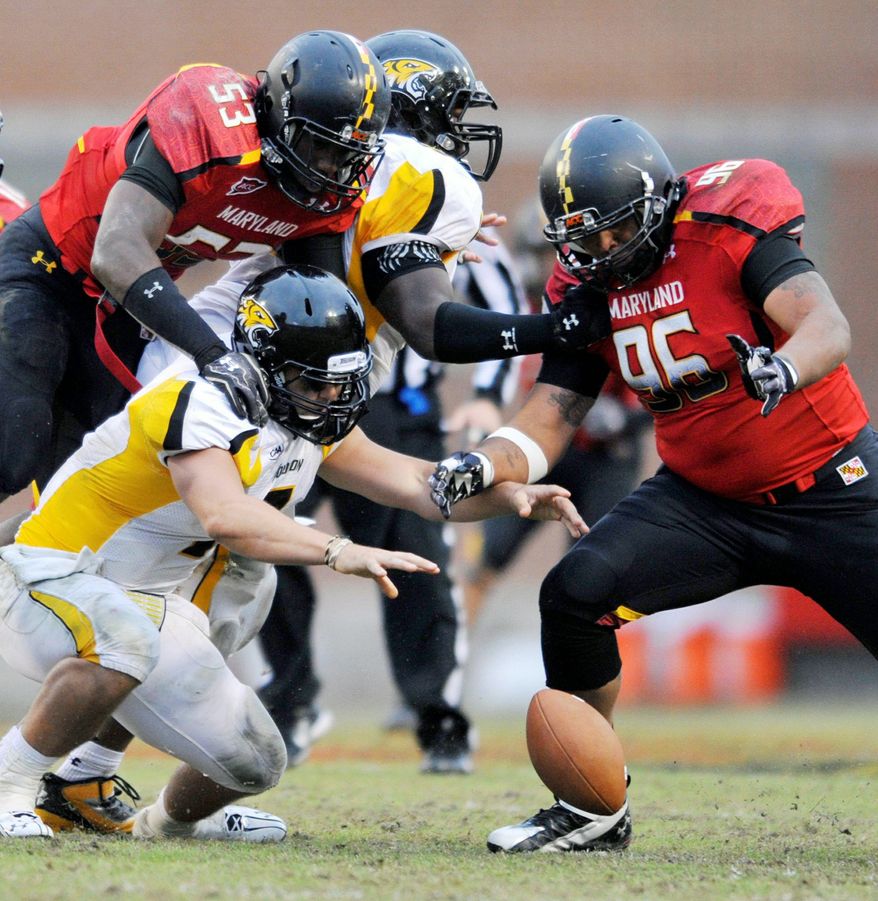 ** FILE ** Maryland defensive tackle A.J. Francis, looking to pounce on a fumble in the Terrapins' win over Towson on Oct. 1, sees 1600 Pennsylvania Ave. as his future address. (Associated Press)