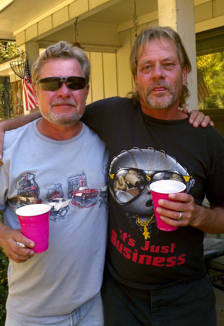 Harold Wayne Lovell (right) and his brother, Tim Lovell, pose for a photo during a family reunion in Ozark, Ala., on Tuesday, Oct. 25, 2011. (AP Photo/Courtesy of Theresa Hasselberg)