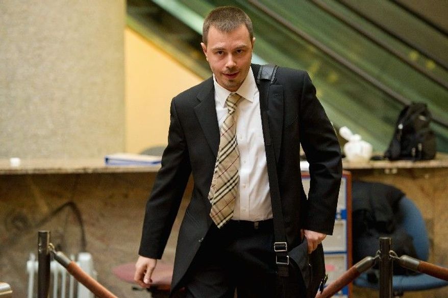 Montgomery County Police Detective Dimitry Ruvin leaves court in Rockville on Monday after testifying in the murder trial of Brittany Norwood. (Andrew Harnik/The Washington Times)