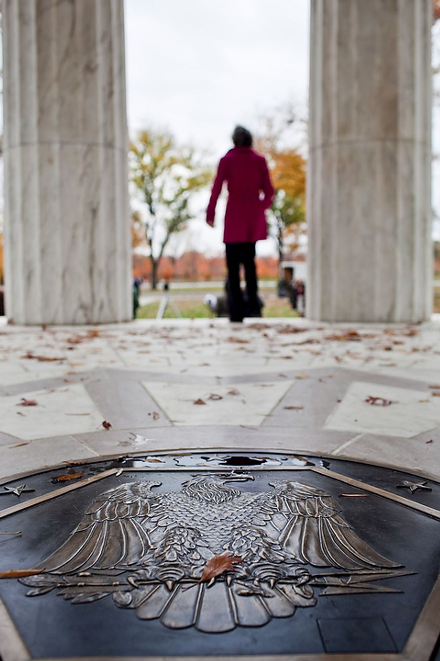 A bronze plaque was specially recreated to replace a missing plaque at the center of the District of Columbia WWI Memorial as part of the memorial's renovation, seen during a rededication ceremony in Washington, D.C. on Nov. 10, 2011. The National Park Service did not have records of the exact design on the original plaque, with the exception of the design including an image of an eagle, but made the replacement to mesh with the marble patterns on the floor.
(T.J. Kirkpatrick/ The Washington Times)