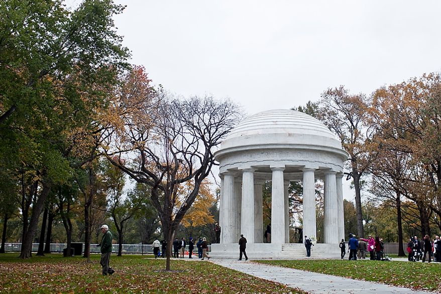 Pedestrians, veterans and members of the media walk around the grounds of the newly renovated District of Columbia WWI Memorial after a rededication ceremony in Washington, D.C. on Nov. 10, 2011.
(T.J. Kirkpatrick/ The Washington Times)