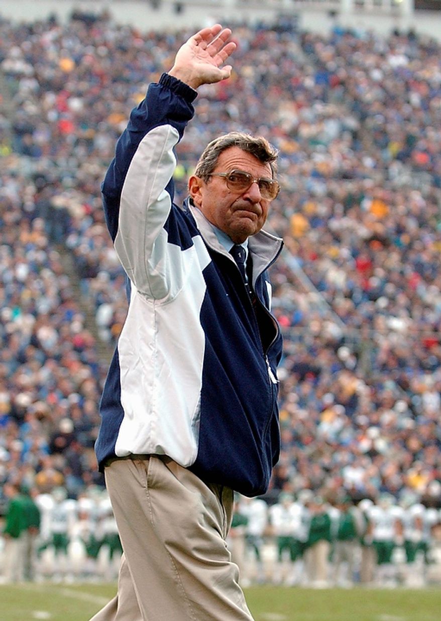 In this Nov. 20, 2004, file photo, Penn State coach Joe Paterno waves to the crowd in the fourth quarter of Penn State's 37-13 win over Michigan State in an NCAA college football game in State College, Pa. Penn State trustees fired Paterno and university president Graham Spanier amid the growing furor over how the school handled sex abuse allegations against an assistant coach. The massive shakeup Wednesday night, Nov. 9, 2011, came hours after Paterno announced that he planned to retire at the end of his 46th season. (AP Photo/Carolyn Kaster, File)