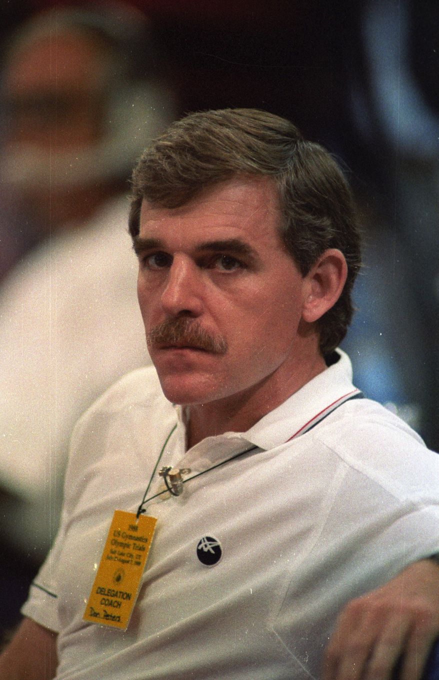 FILE - In this Aug. 4, 1988 file photo, gymnastics coach Don Peters attends the U.S. gymnastics Olympic trials in Indianapolis, Ind. Peters, head coach of the 1984 U.S. women's Olympic team, was declared "permanently ineligible" after a hearing by USA Gymnastics last week. Two former gymnasts have told the Orange County Register they were sexually abused by Peters as teenagers in the 1980s. Peters can't be prosecuted under California law because the statute of limitation has expired. (AP Photo/The Orange County Register)