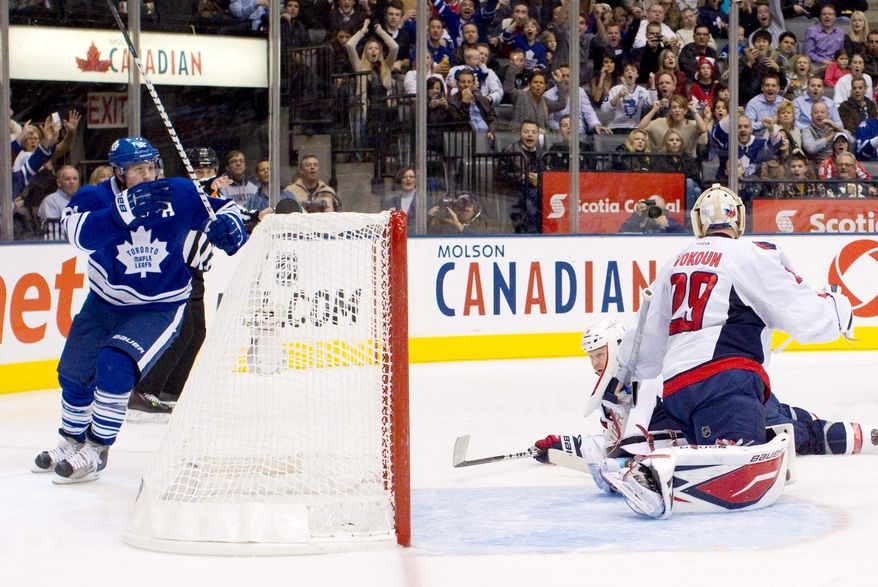 Phil Kessel (left) celebrates scoring Toronto's fourth goal in a 7-1 rout of Washington on Saturday night. The Capitals went 0-3 on their road trip. (Associated Press)