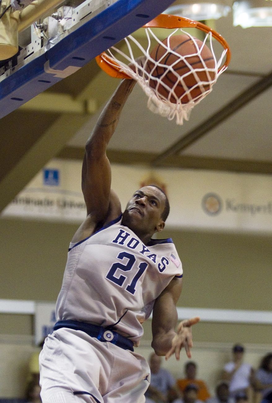 Georgetown guard Jason Clark (21) breaks away for a dunk in the second half of an NCAA college basketball game Tuesday, Nov. 22, 2011, in Lahaina, Hawaii. Georgetown defeated Chaminade 88-61. (AP Photo/Eugene Tanner)