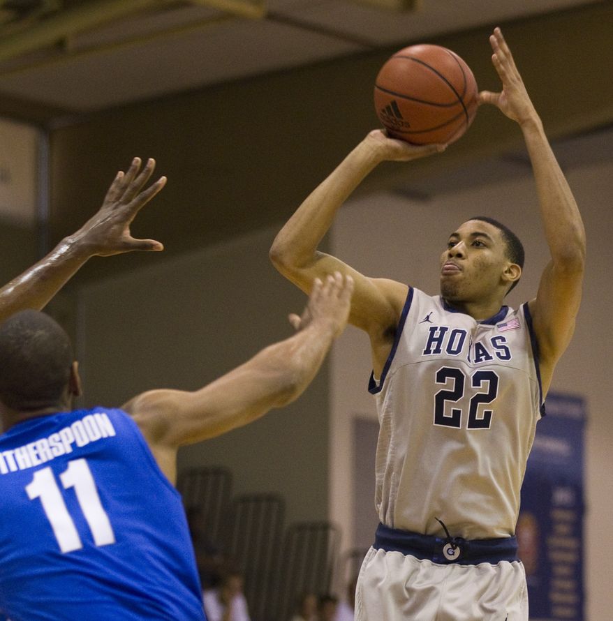 Memphis guard/forward Wesley Witherspoon (11) watches as Georgetown forward Otto Porter (22) puts up a jumpshot in the first half Wednesday, Nov. 23, 2011, in Lahaina, Hawaii. (AP Photo/Eugene Tanner)