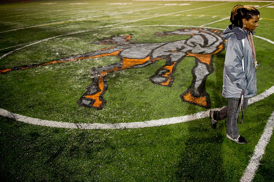 Coolidge High School Football Coach Natalie Randolph gets her team ready for the Turkey Bowl, Washington, DC, Monday, November 21, 2011. (Andrew Harnik/The Washington Times)