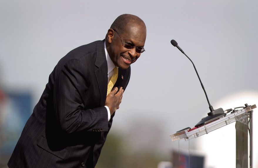 Former corporate executive Herman Cain greets the crowd Saturday at a campaign event in Atlanta, where he suspended his Republican presidential campaign. (Associated Press)