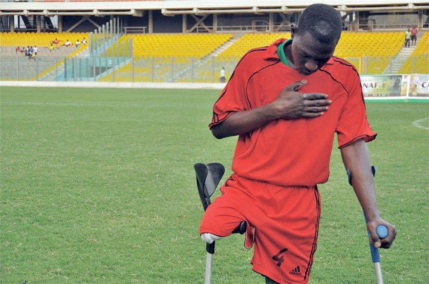 Sani Boubakar of Niger (above) prays and Richard Arthur Opentil of Ghana savors victory after Niger's team lost to Ghana's Black Challenge, which Opentil captains, at last week's 2011 Cup of African Nations for Amputee Football tournament in Ghana. Angola, Liberia, Nigeria and Sierra Leone also fielded teams, and Liberia won the cup. The competitions help players not only overcome their disabilities but also move beyond turbulence in their nations. (Clair MacDougall/Special to The Washington Times)