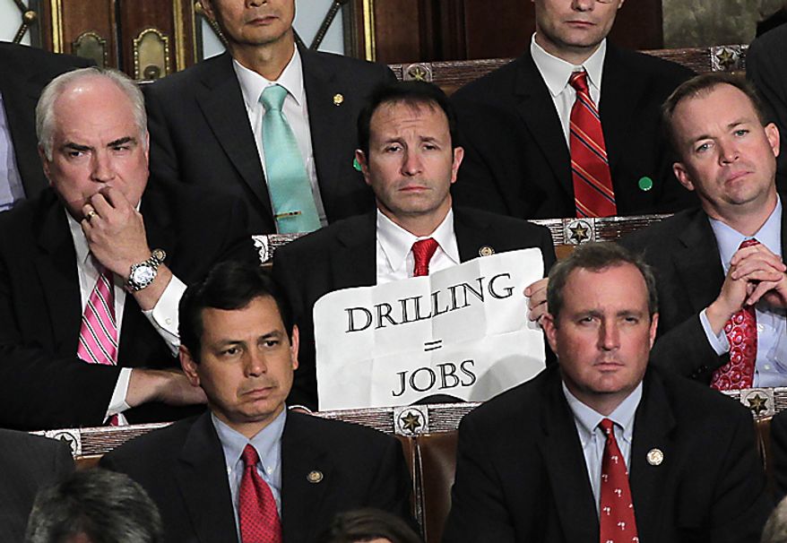 ** FILE ** Rep. Jeff Landry, Louisiana Republican, holds a sign during a speech by President Obama to a joint session of Congress at the Capitol in Washington on Thursday, Sept. 8, 2011. (AP Photo/J. Scott Applewhite)