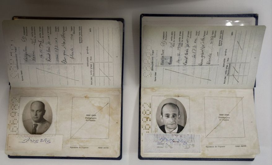 Fake passports used in the daring operation to capture Nazi SS officer Adolf Eichmann are displayed in the Knesset in Jerusalem on Monday, Dec. 12, 2012. The passport at right contains Eichmann's picture. (AP Photo/Sebastian Scheiner)