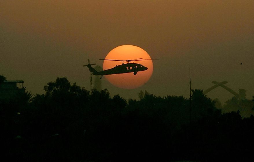 In this Tuesday, Oct 30, 2007 file photo, a U.S. army Black Hawk helicopter flies as the sun sets over Baghdad. In the beginning, it all looked simple: topple Saddam Hussein, destroy his purported weapons of mass destruction and lay the foundation for a pro-Western government in the heart of the Arab world. Nearly 4,500 American and more than 100,000 Iraqi lives later, the objective now is simply to get out _ and leave behind a country where democracy has at least a chance, where Iran does not dominate and where conditions may not be good but "good enough." (AP Photo/Marko Drobnjakovic)