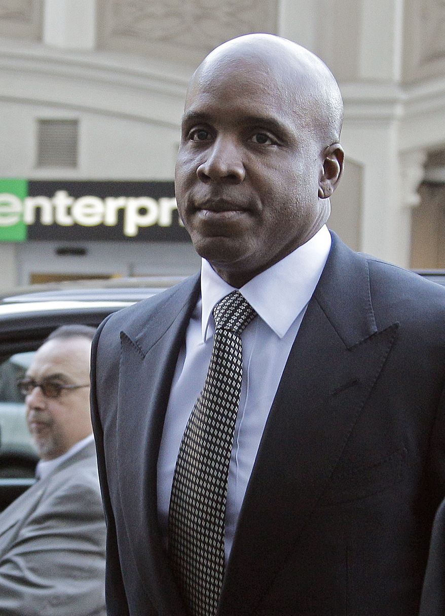 Former baseball player Barry Bonds arrives Dec. 16, 2011, at federal court in San Francisco for sentencing after being convicted in April of obstructing a government investigation into steroid use among athletes. (Associated Press)