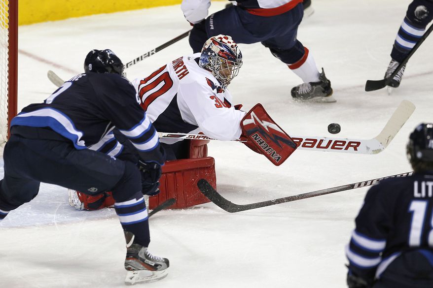 Washington Capitals goaltender Michal Neuvirth made 26 saves in his shutout of the Winnipeg Jets on Thursday night. He'll get the start between the pipes Saturday night against the Colorado Avalanche. (AP Photo/The Canadian Press, John Woods)