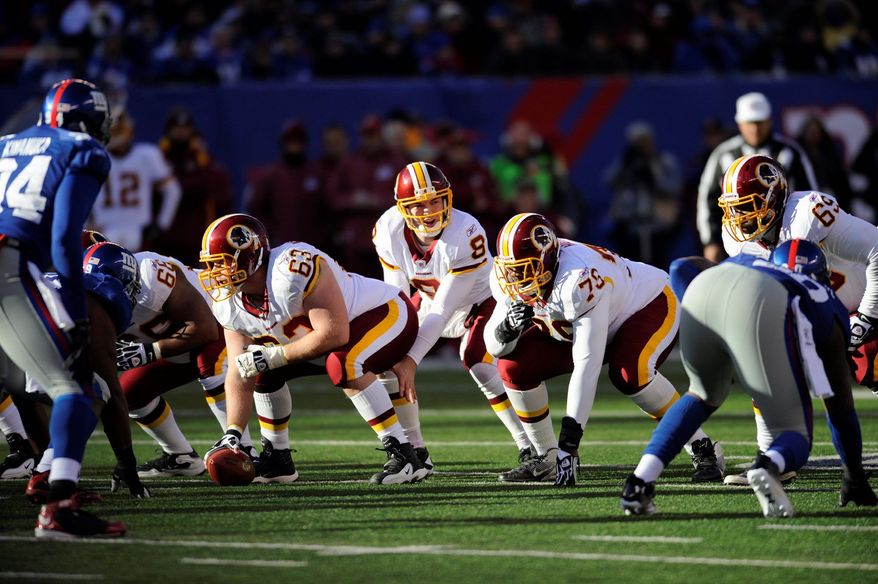 Despite throwing two interceptions, Redskins quarterback Rex Grossman had things well in hand. He finished 15 of 24 for 185 yards, including a 20-yard touchdown pass to Santana Moss during the second quarter. (Associated Press)