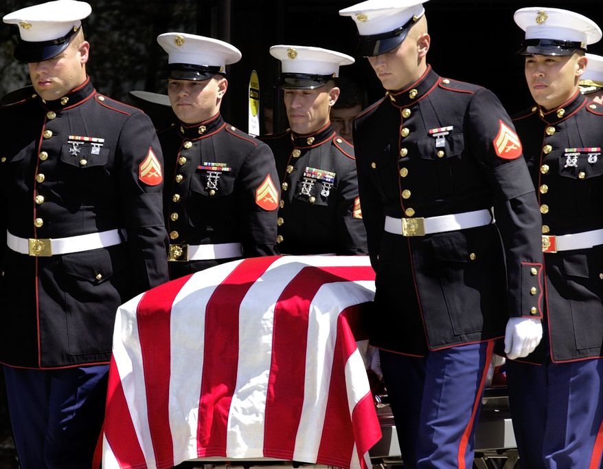 ** FILE ** Members of the U.S. Marine Corps carry the casket of Marine Pvt. Jonathan Lee Gifford at the Maranatha Assembly of God in Decatur, Ill., in April 2003. Gifford, 30, was killed just two days into the Iraq war. (AP Photo/Seth Perlman, File)