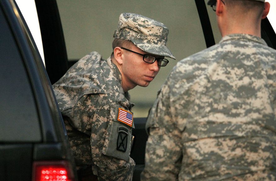 **FILE** Army Pfc. Bradley Manning is escorted from a security vehicle to a courthouse at Fort Meade, Md., on Dec. 19, 2011. (Associated Press)