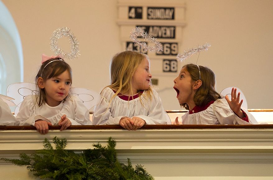Girls portraying angels play on the balcony during a rehearsal of the Nativity scene of the Christ Church Christmas pageant in Alexandria on Sunday, Dec. 18, 2011. (Rod Lamkey Jr./The Washington Times)