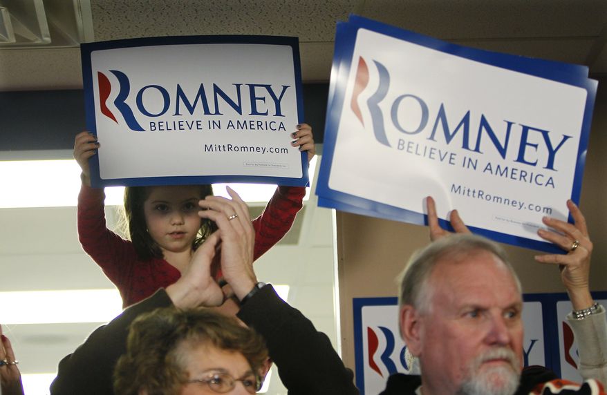 Supporters of Republican presidential candidate, former Massachusetts Gov. Mitt Romney listen during a campaign stop, Saturday, Dec. 31, 2011, in Le Mars, Iowa. (AP Photo/Eric Gay)