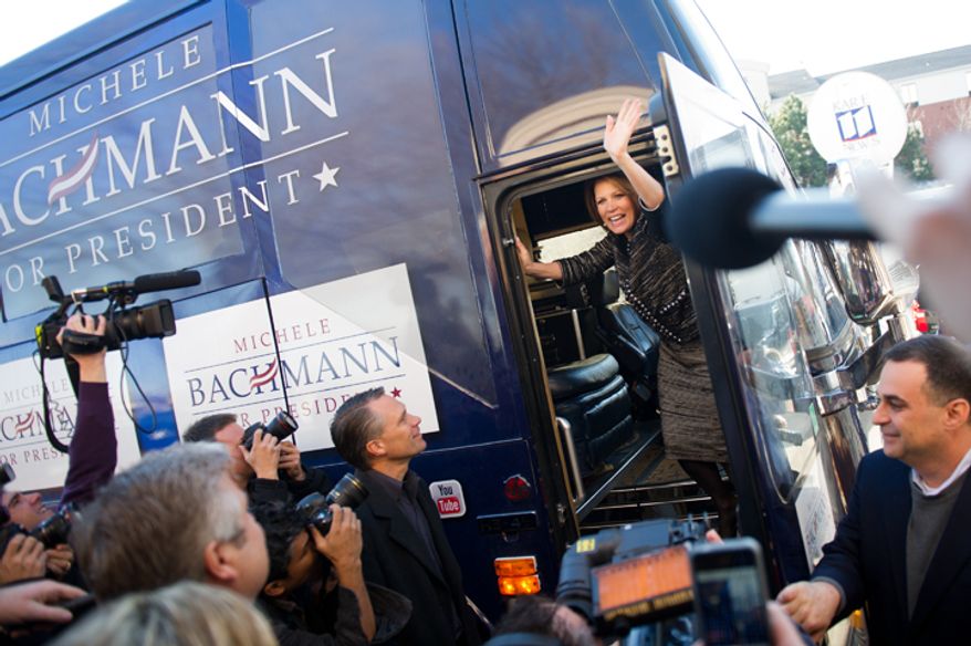 Rep. Michele Bachmann waves goodbye to supporters as she boards her campaign bus on Wednesday, Jan. 4, 2012, in West Des Moines, Iowa, after announcing she will end her campaign for president. (Andrew Harnik/The Washington Times)