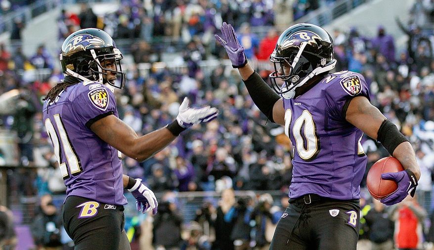 Ravens safety Ed Reed (right) celebrates his interception with cornerback Lardarius Webb during Baltimore's 20-13 victory over Houston in the AFC playoffs. Reed also made six tackles. (Associated Press)