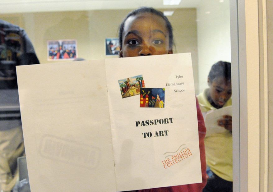 A Tyler Elementary School student holds a program for a young artists exhibition at the Phillips Collection. The gallery shows D.C. students' artwork in its new wing. (James R. Brantley/Special to The Washington Times)