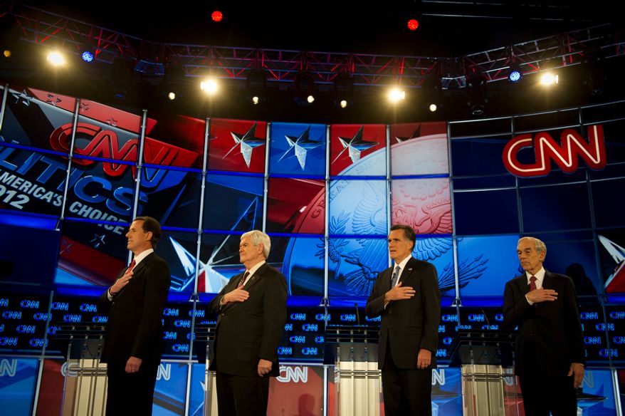 Republican presidential candidates (Left to Right) former Pennsylvania Senator Rick Santorum, former House Speaker Newt Gingrich, former Massachusetts Governor Mitt Romney and Rep. Ron Paul (R-Tex) stand for the singing of the National Anthem as they arrive on stage for the Florida Republican Presidential Debate at the University of North Florida in Jacksonville, Fla., Thursday, January 26, 2012. This is the second and final debate before the Florida Republican primary on Tuesday, January 31, 2012. (Rod Lamkey Jr/ The Washington Times)