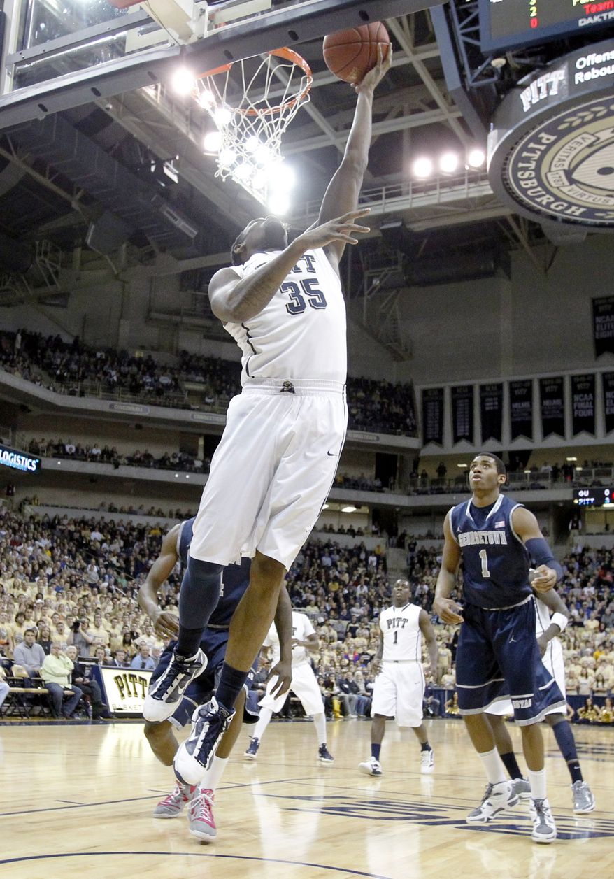 Pittsburgh's Nasir Robinson goes in for an easy layup in front of Georgetown's Hollis Thompson on Saturday, Jan. 28, 2012, in Pittsburgh. Pittsburgh upset ninth-ranked Georgetown 72-60. (AP Photo/Keith Srakocic)