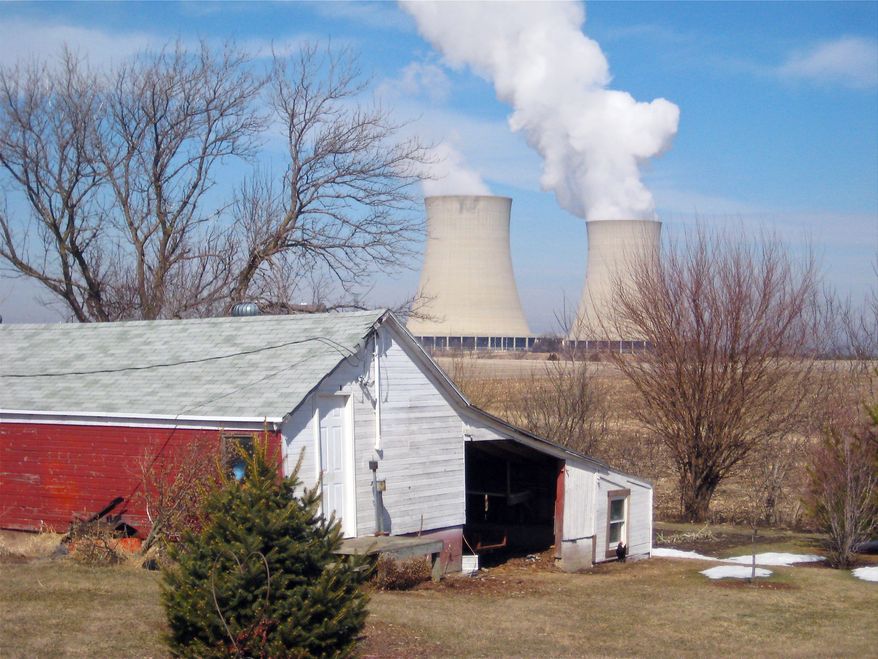 ** FILE ** Steam vapor rises from the cooling towers of Exelon Corp.'s nuclear plant in Byron, Ill, in March 2011. (AP Photo/Robert Ray, File)