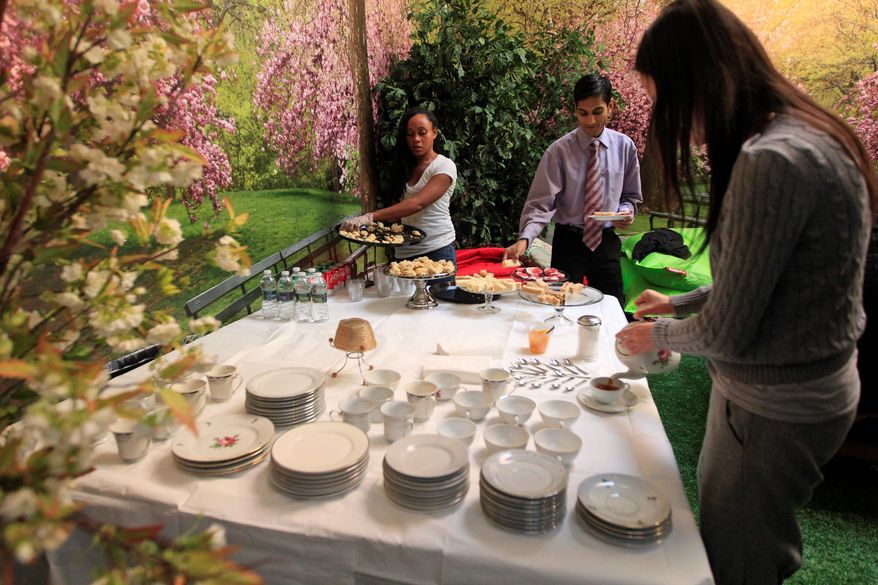High tea is served one afternoon in Park Here. Other events might include a movie on the lawn or a ping-pong tournament. The free-to-visit park will close Feb. 15 and return to its primary use as a "pop-up" business venue. (Associated Press)