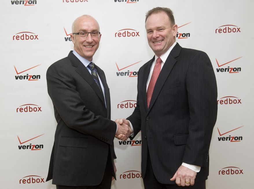 Bob Mudge (right), president of Verizon Consumer and Mass Business Markets, and Paul Davis, CEO of Coinstar Inc., announce a joint video-streaming venture in New York on Monday, Feb. 6, 2011. (Diane Bondareff/AP Images for Redbox)