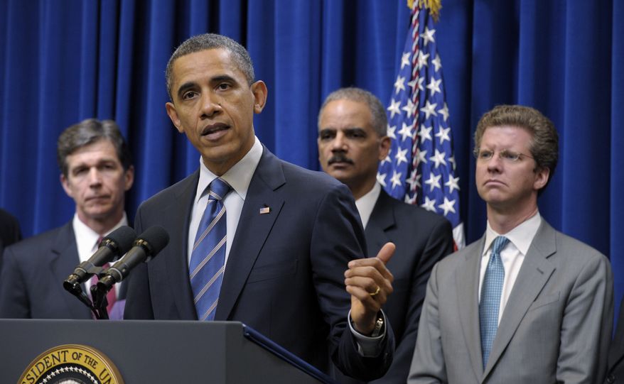 President Obama (second from left) speaks about a settlement with the nation's five largest banks over foreclosures on Thursday, Feb. 9, 2012, in Washington. With the president are North Carolina Attorney General Roy Cooper (left), Attorney General Eric H. Holder Jr. (second from right) and Housing and Urban Development Secretary Shaun Donovan. (AP Photo/Susan Walsh)