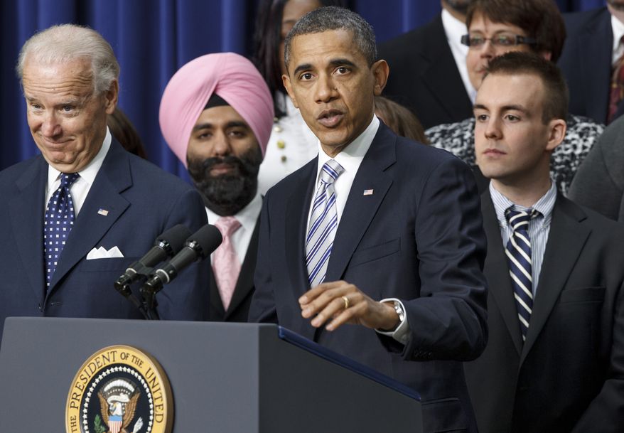 President Obama, accompanied by Vice President Joseph R. Biden Jr. (left), talks on Tuesday, Feb. 21, 2012, about the importance of the payroll-tax cut and jobless-benefits extension passed by Congress last week. Joining the president and vice president at the Eisenhower Executive Office Building at the White House complex in Washington are people who posted comments on the White House website about how the tax cut would affect them. (AP Photo/J. Scott Applewhite)