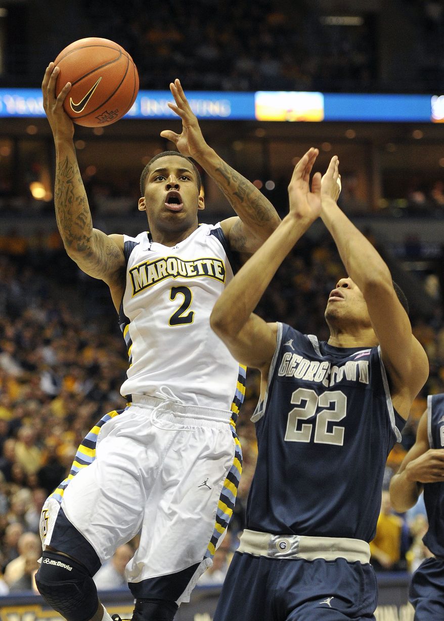 Marquette's Vander Blue drives to the basket against Georgetown's Otto Porter during the first half Saturday, March 3, 2012, in Milwaukee. Blue had 13 points in Marquette's 73-59 win. (AP Photo/Jim Prisching)