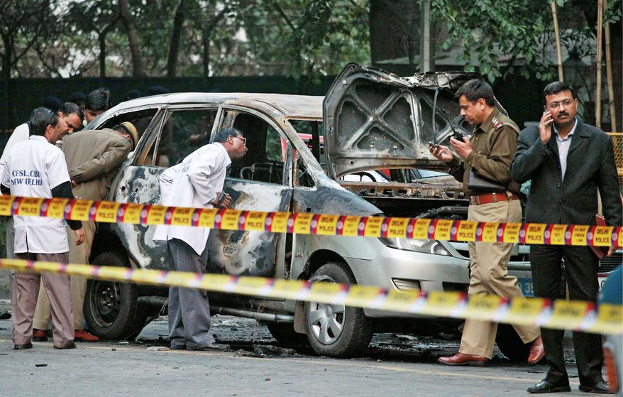 An Israeli diplomat's wife, her driver and two other people in a nearby car were injured when a magnetic bomb is believed to have been attached to the diplomat's car and then detonated. (Associated Press)